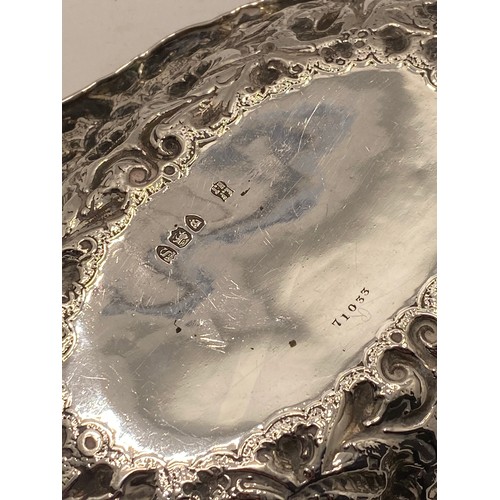 221 - Silver oval embossed bon bon dish with decorative flower and scroll detailing, hallmarked London 189... 