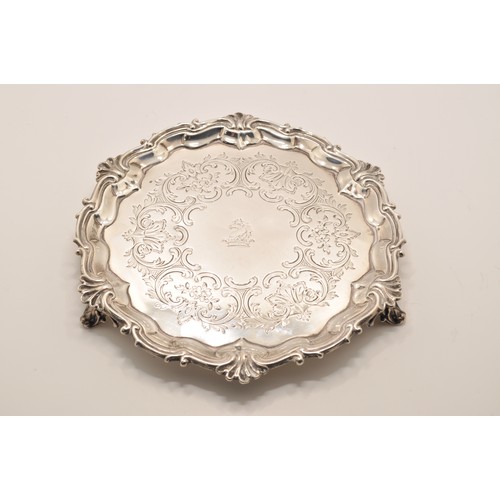 223 - Victorian silver card tray with flower foliate engraved detailing on raised feet, diameter 19cm, hal... 