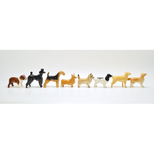 382 - A group of Beswick dogs to include Poodle, Spaniel etc. x8 in total