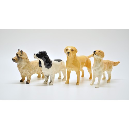 382 - A group of Beswick dogs to include Poodle, Spaniel etc. x8 in total