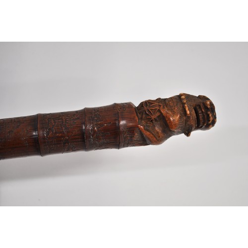 5 - Antique Chinese bamboo walking stick with carved pommel of a foo dog and hand-carved temple designs ... 