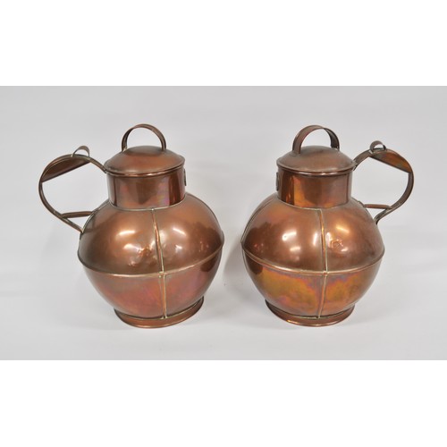 18 - A pair of Martins of Guernsey Copper Jugs, approx H35cm