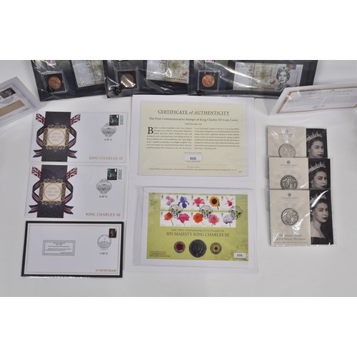 65 - A quantity of commemorative coins, stamps and medallions pertaining to Queen Elizabeth II and King C... 