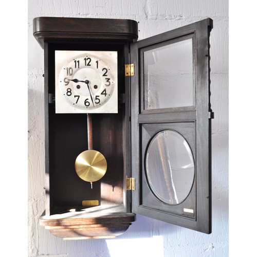 117 - Oak cased wall clock with a striking regulator, with a twisted column design to oak case top panel w... 