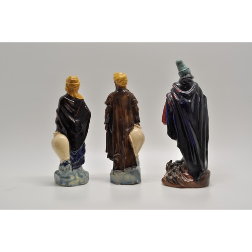 145 - In the style of Royal Doulton,  glazed Moorish and pied piper figures (x3 items) A/F