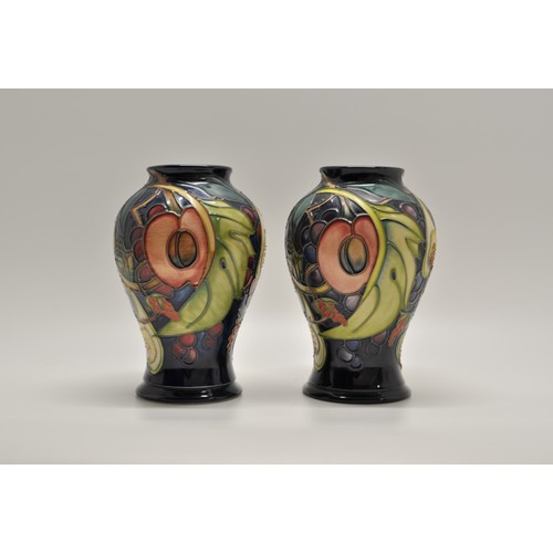 164 - x2 Moorcroft Queens Choice baluster vases impressed and painted marks to base, approx H16cm
