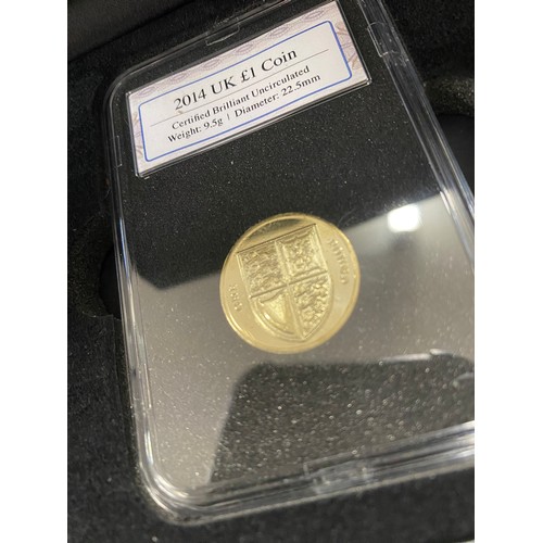 67 - Group of boxed coins to include 2014 UK £1 coin, £5 and 50p Platinum Jubilee pair coin set, Sir Walt... 