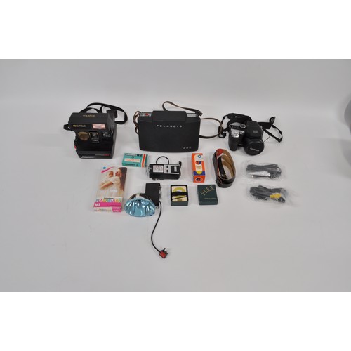 10 - Cameras  to include Polaroid 660 autofocus, Polaroid automatic 355 with case, accessories and a Fuji... 