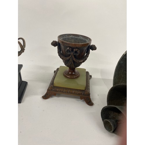 23 - Antique bell, possibly Persian with emblem, approx length 30cm together with two small urns on plint... 