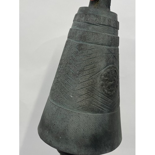 23 - Antique bell, possibly Persian with emblem, approx length 30cm together with two small urns on plint... 