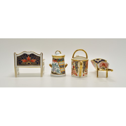 43 - Royal Crown Derby collection consisting of garden bench, wheelbarrow, watering can and tree of life,... 