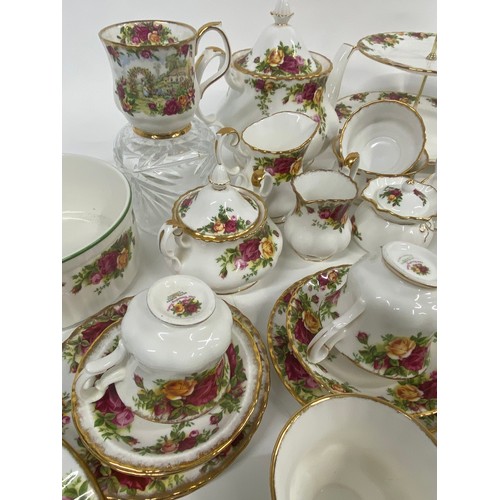 76 - A large quantity of Royal Albert Old Country Roses to include cake stand, teapot, milk jug, sugar bo... 