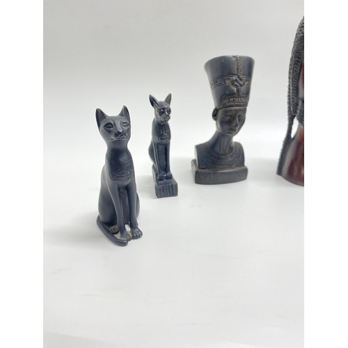 84 - African/Egyptian figures and treen predominately hand carved, also includes a Westair sphinx cat etc... 