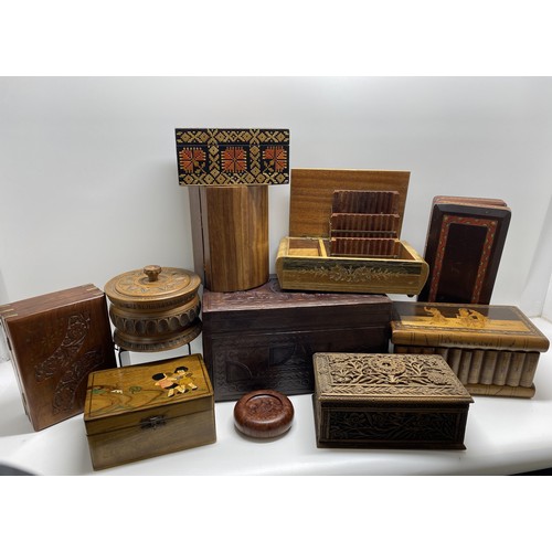 85 - An assortment of storage/jewellery/trinket/cigarette boxes and other items some hand carved, with ke... 