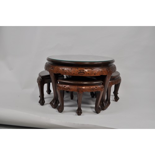 93 - Opium table complete with glass top, under the glass is a heavily 3D carved oriental scene, includes... 