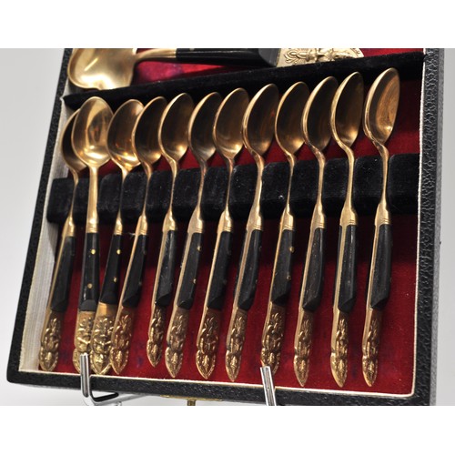 106 - Set of x12 tea spoons with sugar spoon. The handles are decorated with image of Hindu Deity, marked ... 