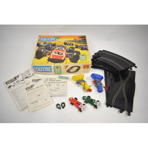 165 - Boxed Scalextric Set 30, complete with cars and controllers, track and a separate power unit, with e... 