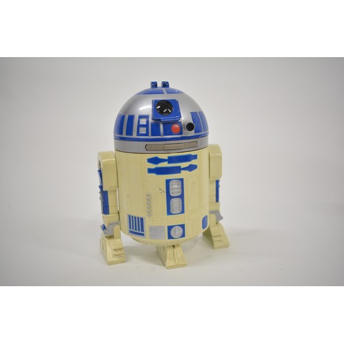 168 - Stars Wars Interest - A collection of Star Wars items to include pod racing figures, R2D2 micro mach... 