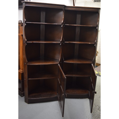 86 - Pair of Ercol corner cabinets with three open shelves above lower cupboard, approx H180cm