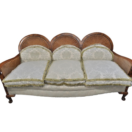 90 - Antique caned bergere sofa with unusual tri-circular form to back design, complete with feathered cu... 