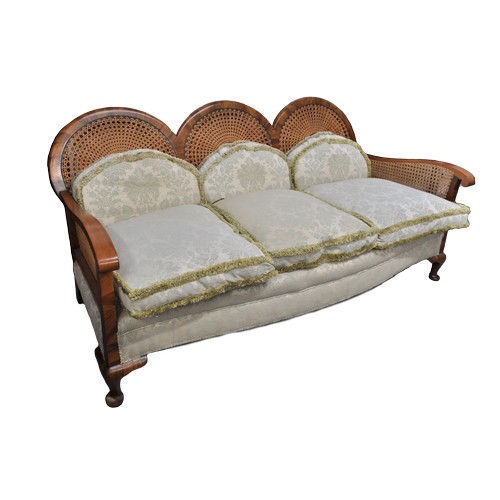 90 - Antique caned bergere sofa with unusual tri-circular form to back design, complete with feathered cu... 