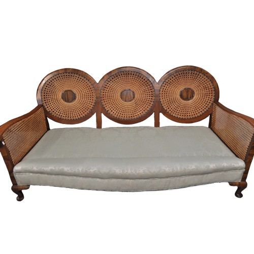 90 - Antique caned bergere sofa with unusual tri-circular form to back design, complete with feathered cu... 