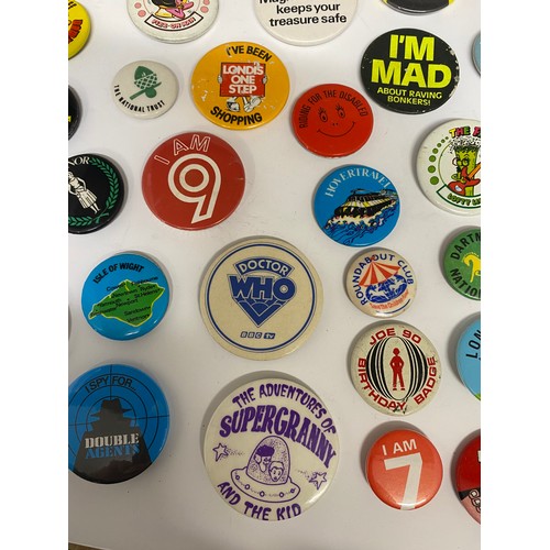 148 - A large collection of pin badges mixed themes to include pop, music, UK attractions,  merchandise ad... 