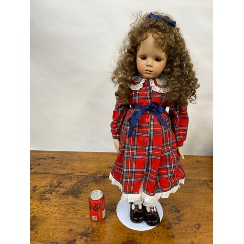 200 - Handmade doll in tartan attire, with porcelain face and limbs, removable curly locks, H74cm includin... 