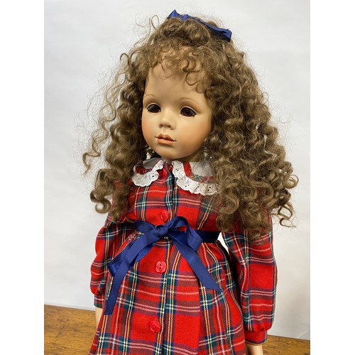 200 - Handmade doll in tartan attire, with porcelain face and limbs, removable curly locks, H74cm includin... 