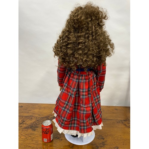 200 - Handmade doll in tartan attire, with porcelain face and limbs, removable curly locks, H74cm includin... 