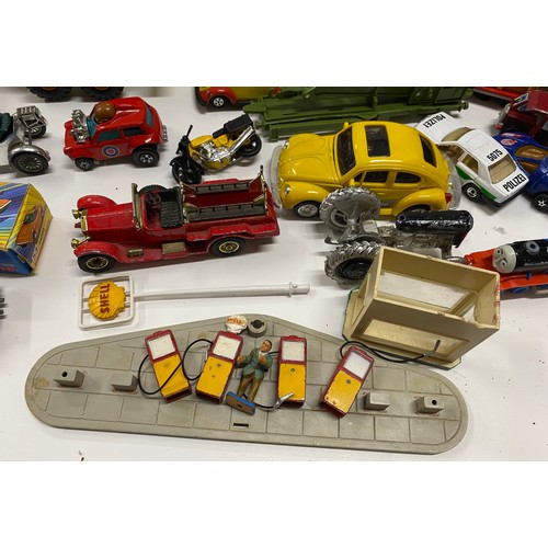 155C - A large quantity of diecast and other mixed cars and vehicles to include  Shell petrol pumps, Thomas... 