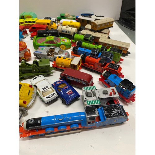 155C - A large quantity of diecast and other mixed cars and vehicles to include  Shell petrol pumps, Thomas... 