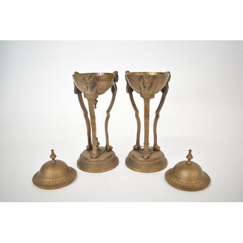 11 - Pair of Egyptian revival bronzed lidded tripod urns. Approx H30cm