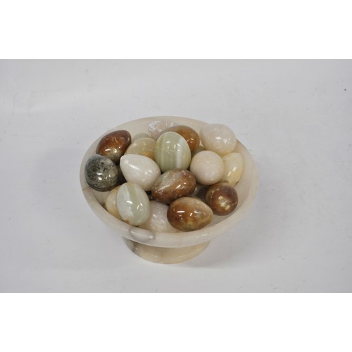 73 - An Onyx Bowl containing various Onyx and other eggs