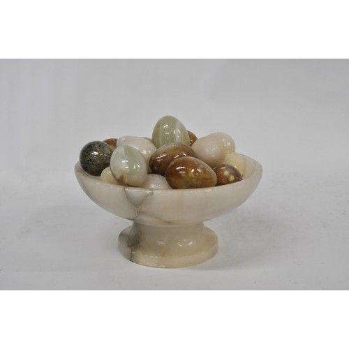 73 - An Onyx Bowl containing various Onyx and other eggs