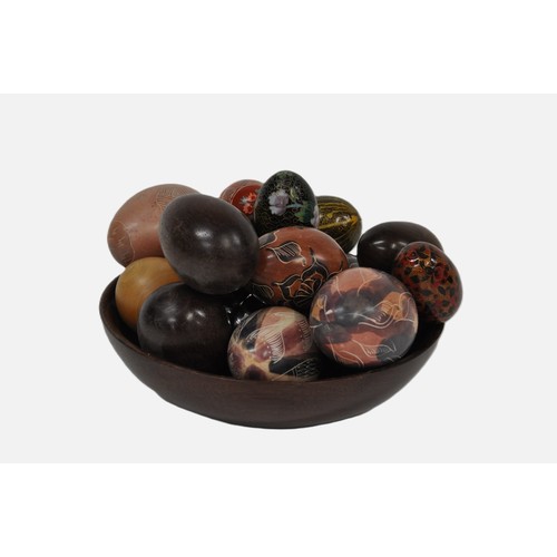 74 - Wooden bowl containing various eggs some with hand painted designs