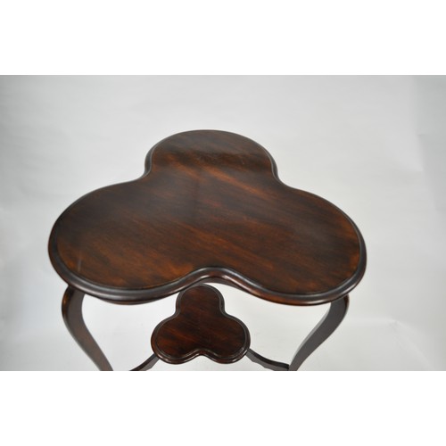 132 - Victorian clover shaped two tiered mahogany occasional table together with Edwardian two tier plant ... 