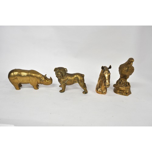 150 - A group of brass animal figures consisting Horse head, Eagle, Bulldog and a rhino