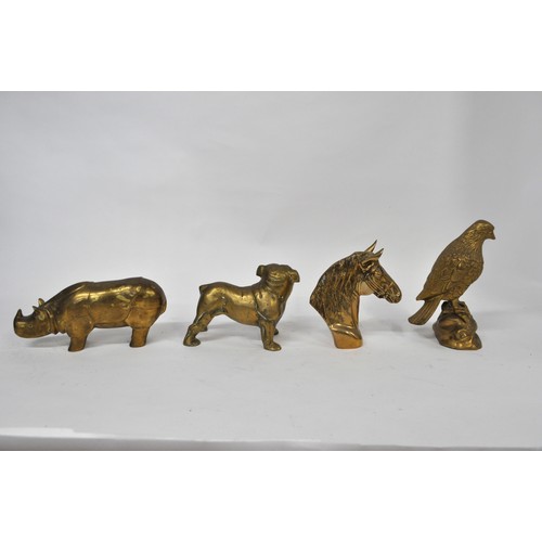 150 - A group of brass animal figures consisting Horse head, Eagle, Bulldog and a rhino