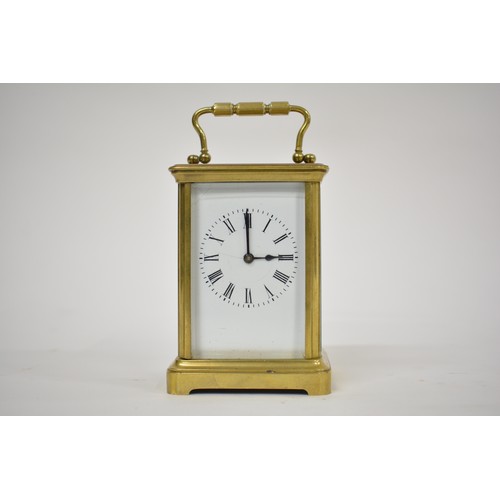 179 - Brass Carriage Clock in leather case, with key. AF