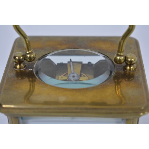 179 - Brass Carriage Clock in leather case, with key. AF