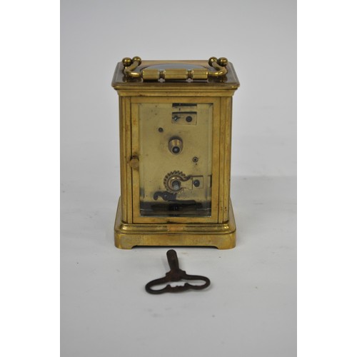 179 - Brass Carriage Clock in leather case, with key. AF