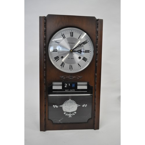 181 - President 30 day wall clock with day/date window, with pendulum.