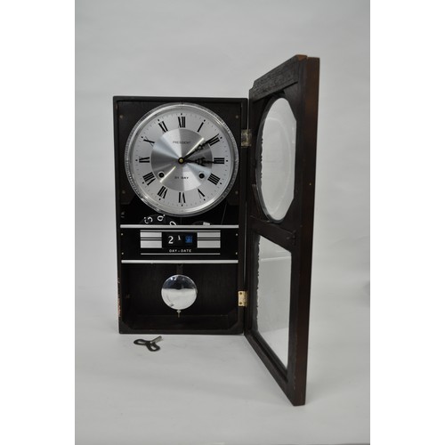 181 - President 30 day wall clock with day/date window, with pendulum.