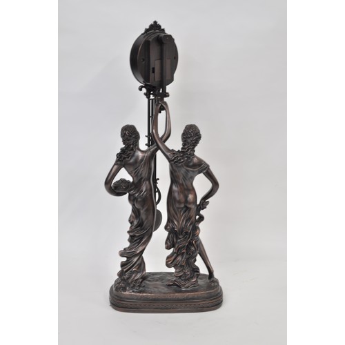 182 - Julianna Studios swinging mantle clock in the form of 2 ladies in robes. 79cm tall. untested.