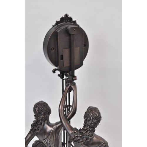 182 - Julianna Studios swinging mantle clock in the form of 2 ladies in robes. 79cm tall. untested.