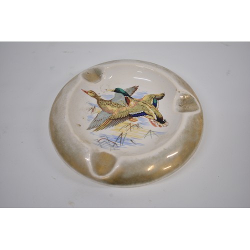 219 - Flying Mallard and duck themed items consisting of plates, decanter, ashtray, and artwork