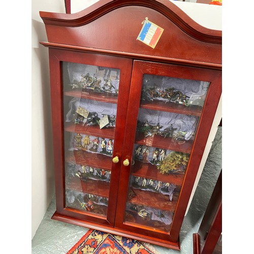 242 - A display cabinet full of military metal figures some Del Prado, predominantly Napoleonic Wars, some... 