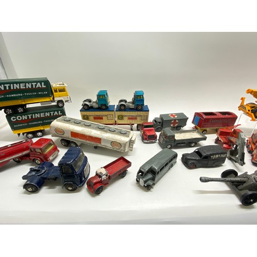 246 - A variety of Dinky and other diecast vehicles, to include industrial, freight, and military-related