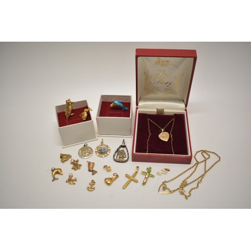 305 - Various gold charms (x12) with necklace stamped 10k, crucifix pendant marked 14ct and other mixed me... 